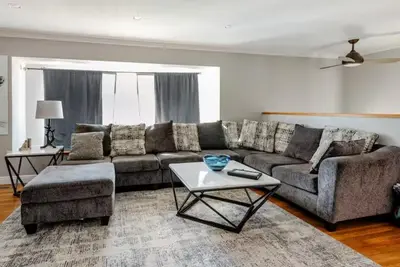 a living room with a couch and a coffee table at 4 Bedrooms and 5 Beds with Game Room Only 5 min Drive to College and Perfect for Family's in Boulder