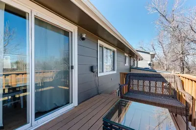 a balcony with a bench on a house at 4 Bedrooms and 5 Beds with Game Room Only 5 min Drive to College and Perfect for Family's in Boulder