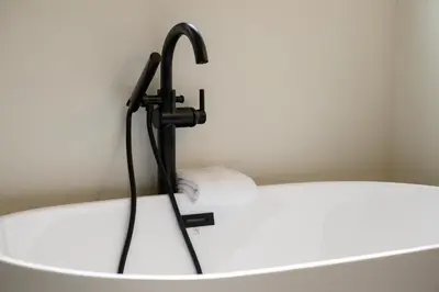 a bathroom with a bath tub with a faucet at Ridgeview at Granby Ranch townhouse in Granby