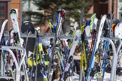 a bunch of skis are lined up in a rack at Ridgeview at Granby Ranch townhouse in Granby