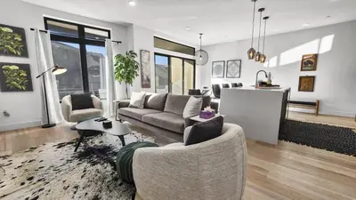 a living room with a couch and a table at 2BDR New Build Minutes to Dillon Reservoir in Silverthorne