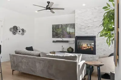 a living room with a couch and a fireplace at 2BDR New Build Minutes to Dillon Reservoir in Silverthorne