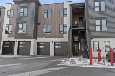 a red fire hydrant in front of a building at 2BDR New Build Minutes to Dillon Reservoir in Silverthorne