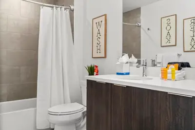 a bathroom with a toilet and a sink and a shower at 2BDR New Build Minutes to Dillon Reservoir in Silverthorne