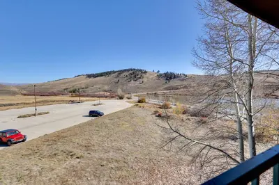a view of a road with a mountain in the background at Private Balcony and Mtn Views Granby Studio! in Granby