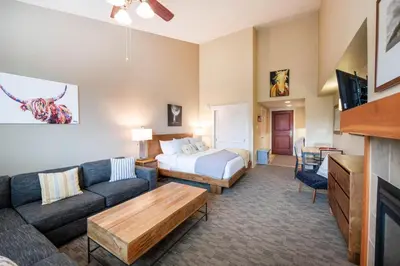 a living room with a couch and a bed at Premium Unit 4650- Fraser Crossing Founders Pointe condo in Winter Park
