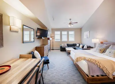 a large room with two beds and a couch at Premium Unit 4650- Fraser Crossing Founders Pointe condo in Winter Park