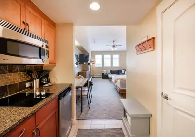 a kitchen and living room in a apartment at Premium Unit 4650- Fraser Crossing Founders Pointe condo in Winter Park