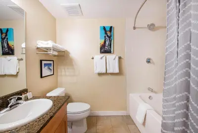 a bathroom with a sink and a toilet and a tub at Premium Unit 4650- Fraser Crossing Founders Pointe condo in Winter Park