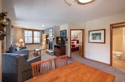 a living room with a dining table and a living room at Premium Unit 1327 - 1 Bedroom - Zephyr Mountain condo in Winter Park