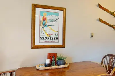 a picture on a wall with a table with a picture at Salt Lick Sanctuary in Silverthorne