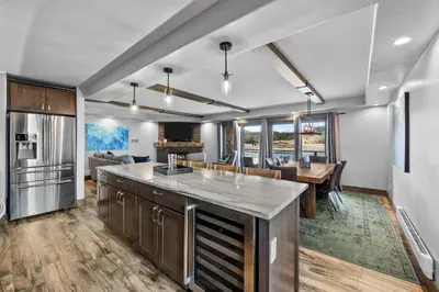 a kitchen and living room with a table and a dining room at Corinthian Circle - Dillon in Dillon