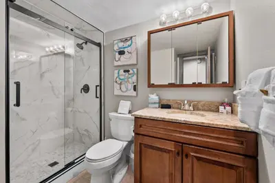 a bathroom with a shower and a toilet and a sink at Corinthian Circle - Dillon in Dillon