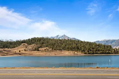 a view of a lake with mountains in the background at Corinthian Circle - Dillon in Dillon