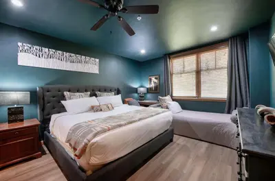 a bedroom with two beds and a ceiling fan at Premium Unit 1403 - 2 Bedrooms - Zephyr Mountain condo in Winter Park