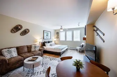 a living room with a couch and a table at Premium Unit 3522- Fraser Crossing Founders Pointe condo in Winter Park