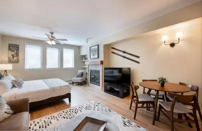 a living room with a bed and a dining room at Premium Unit 3522- Fraser Crossing Founders Pointe condo in Winter Park