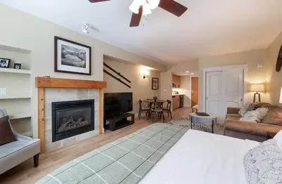 a living room with a fireplace and a couch at Premium Unit 3522- Fraser Crossing Founders Pointe condo in Winter Park