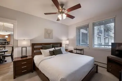 a bedroom with a bed and a ceiling fan at Premium Unit 3513- Fraser Crossing Founders Pointe condo in Winter Park