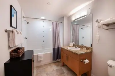 a bathroom with a sink and a tub and a toilet at Premium Unit 3513- Fraser Crossing Founders Pointe condo in Winter Park