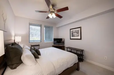 a bedroom with a bed and a ceiling fan at Premium Unit 3513- Fraser Crossing Founders Pointe condo in Winter Park