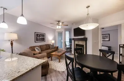 a living room with a couch and a table at Premium Unit 3513- Fraser Crossing Founders Pointe condo in Winter Park