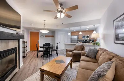 a living room with a couch and a fireplace at Premium Unit 3513- Fraser Crossing Founders Pointe condo in Winter Park