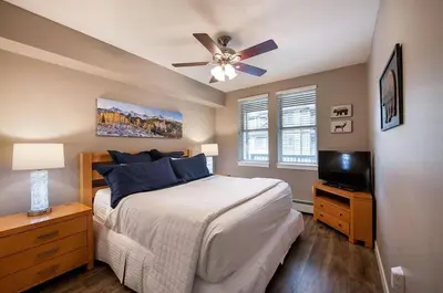 a bedroom with a bed and a ceiling fan at Premium Unit 3519- Fraser Crossing Founders Pointe condo in Winter Park