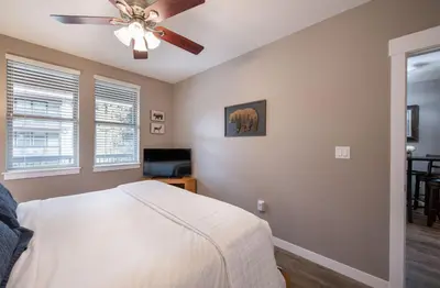 a bedroom with a bed and a ceiling fan at Premium Unit 3519- Fraser Crossing Founders Pointe condo in Winter Park