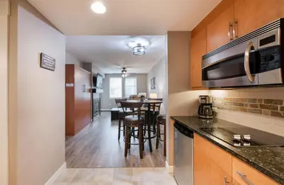 a kitchen and dining room with a dining table at Premium Unit 3519- Fraser Crossing Founders Pointe condo in Winter Park