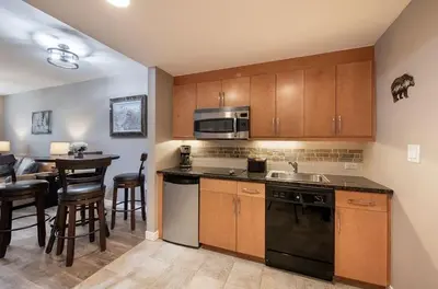 a kitchen with a sink and a stove top oven at Premium Unit 3519- Fraser Crossing Founders Pointe condo in Winter Park
