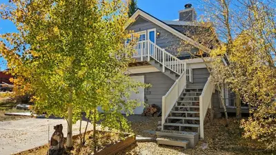 a house with stairs leading up to it at Manorhouse Hideaway in Dillon