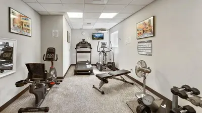 a gym with several exercise equipment in a room at Manorhouse Hideaway in Dillon