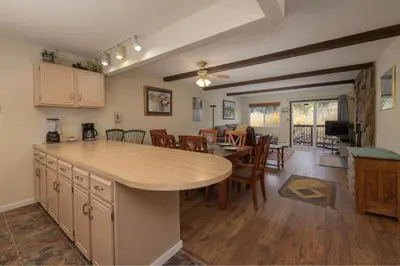 a kitchen and dining room with a table and chairs at Hi Country Haus Unit 1803 in Winter Park