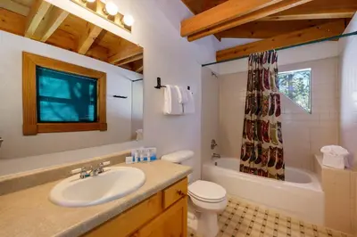 a bathroom with a sink and a toilet and a tub at 980 Mulligan in Fraser