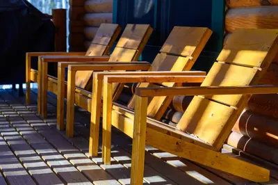 a row of wooden benches sitting on a porch at 980 Mulligan in Fraser