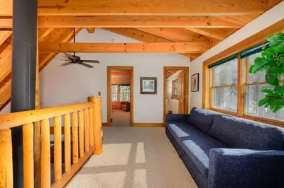a living room with a couch and a wooden ceiling at 980 Mulligan in Fraser