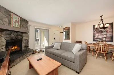 a living room with a couch and a fireplace at Meadow Ridge Court 18 Unit 4 in Fraser