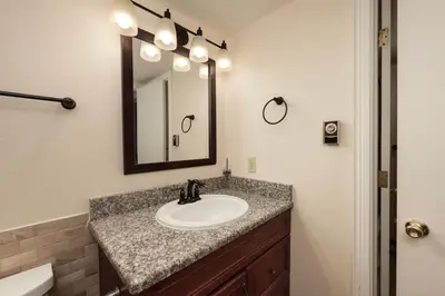 a bathroom with a sink and a mirror at Meadow Ridge Court 18 Unit 4 in Fraser