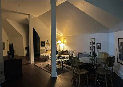 a living room with a table and a couch at The Currier Inn in Greeley