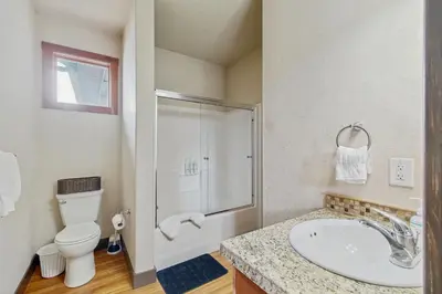 a bathroom with a sink and a shower and a toilet at Silver Sage Sanctuary in Granby