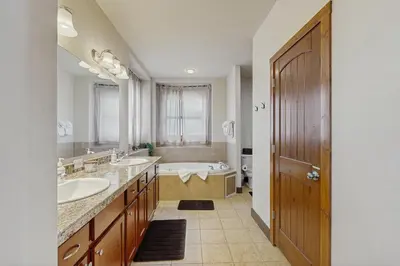 a large bathroom with two sinks and a tub at Silver Sage Sanctuary in Granby