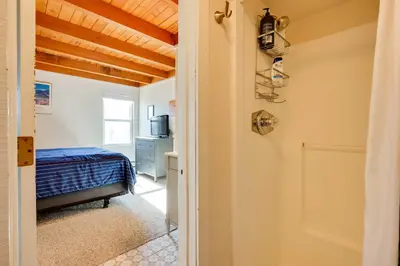 a bedroom with a bed and a door to a room at Mtn-View Condo with Community Perks in Silverthorne in Silverthorne