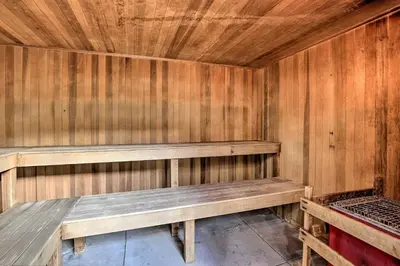 a wooden sauna with a bench in a room at Mtn-View Condo with Community Perks in Silverthorne in Silverthorne