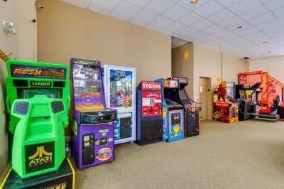 a room with arcade games and video game machines at Mtn-View Condo with Community Perks in Silverthorne in Silverthorne