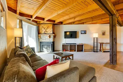 a living room with a couch and a fireplace at Mtn-View Condo with Community Perks in Silverthorne in Silverthorne