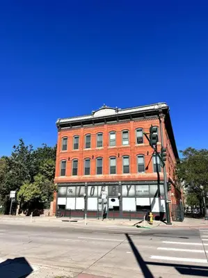 a large red brick building on the corner of a street at Affordable & Chic RiNo/LoDo/Dtown Loft- Walkable in Denver