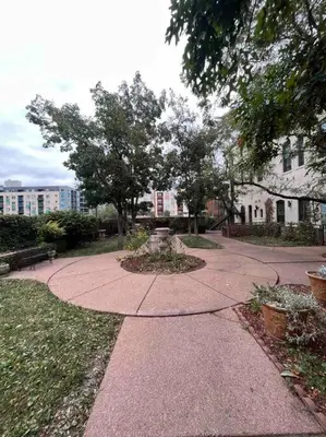 a walkway in a park with a bench and trees at Affordable & Chic RiNo/LoDo/Dtown Loft- Walkable in Denver