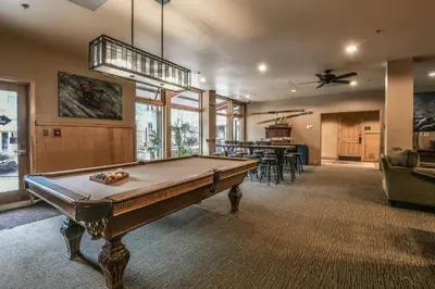 a large room with a pool table in it at 8179 Silver Mill condo in Keystone