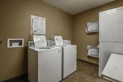 a laundry room with two washer and dryers at 8179 Silver Mill condo in Keystone